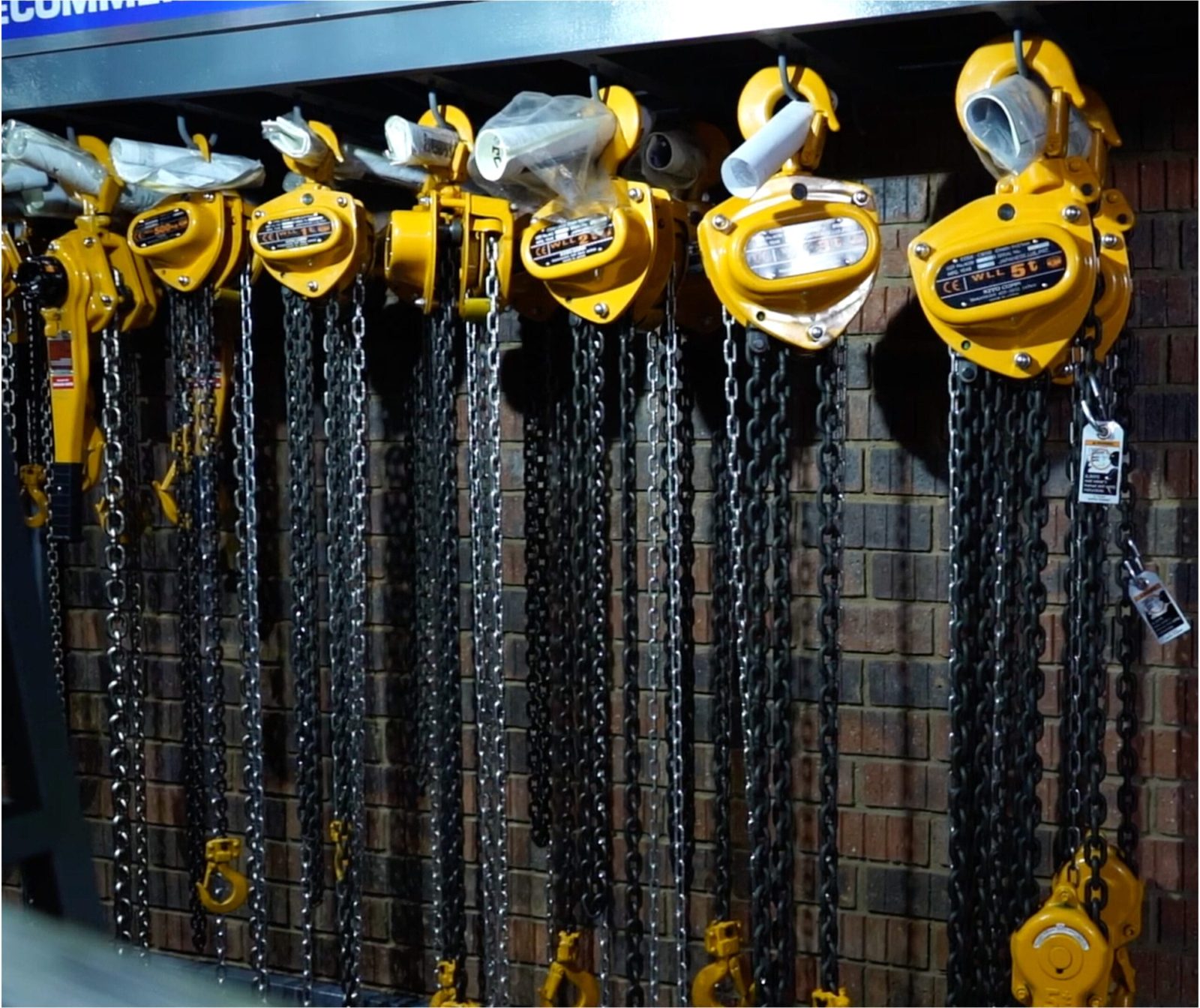 Row of yellow Kito chain hoists