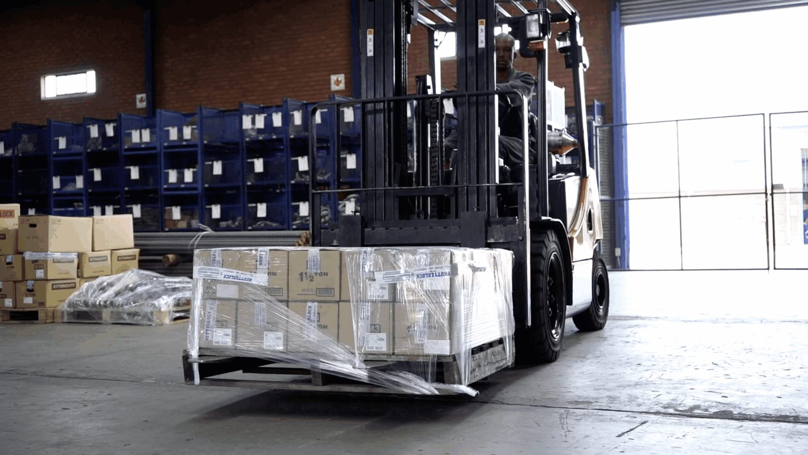 Forklift loading stored equipment for direct transport to site